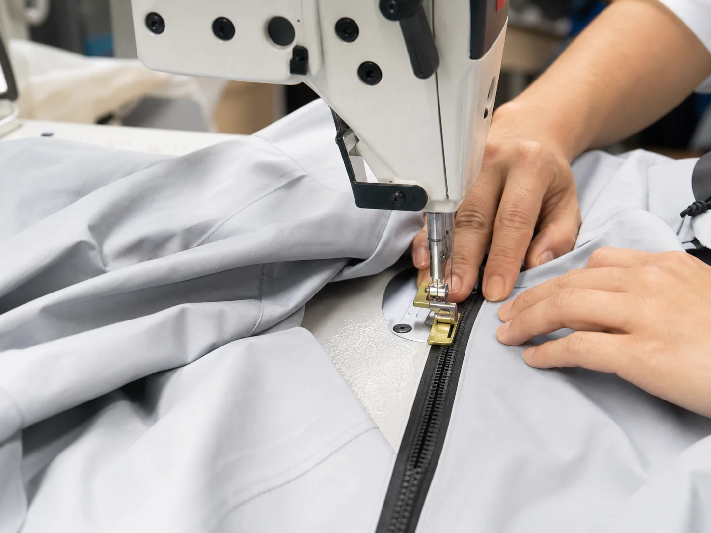 Industrial sewing machine attaching a waterproof zipper